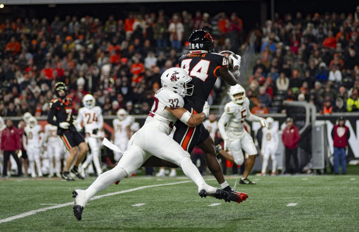 Tight end Jermaine Terry II snags a pass through the hit by the Washington State
defender in Reser Stadium on Nov 23. Terry II racked up 92 receiving yards and a touchdown on only 5 receptions against the Cougars