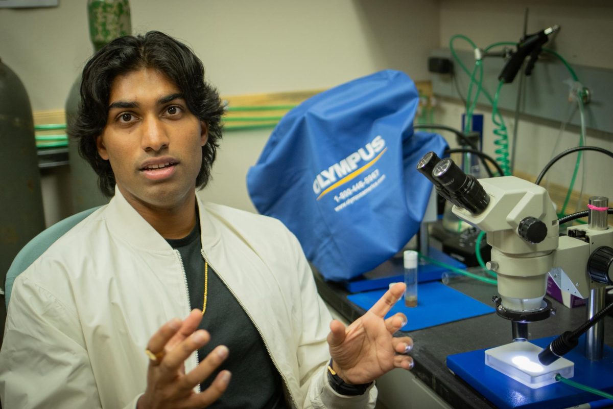 Riitvek Baddiereddi, a premedical student and president of the Medical Sciences Club explains his research in the Agricultural & Life Sciences building at Oregon State University on Nov 5.