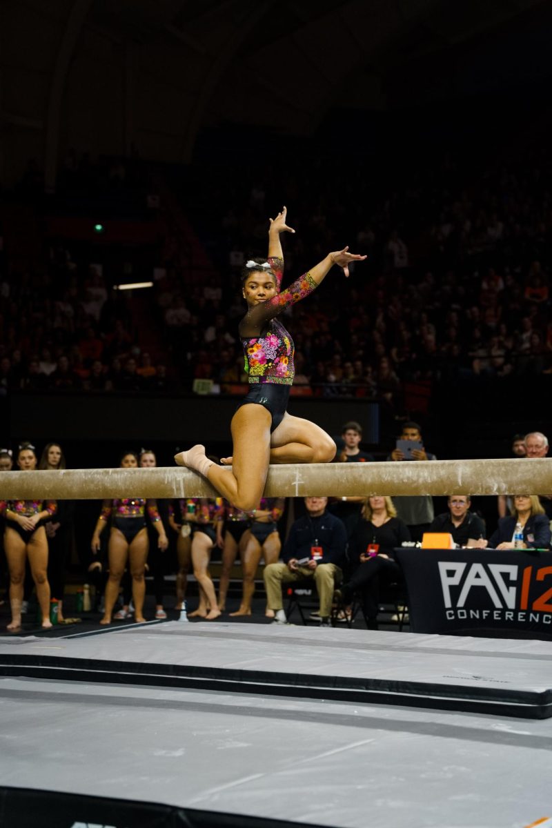 Jennifer McMillan competes on beam at the Oregon State University v. Brown gymnastics meet at Gill Coliseum on January 21st, 2024. She scored 9.700.