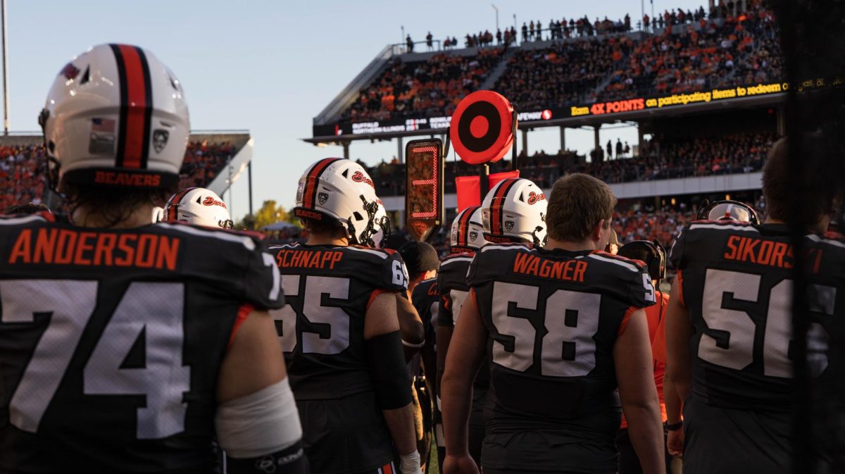 The OSU Beavers watch and cheer on their teammates in OSU’s game against Purdue in Reser Stadium on Sept 21 in Corvallis.