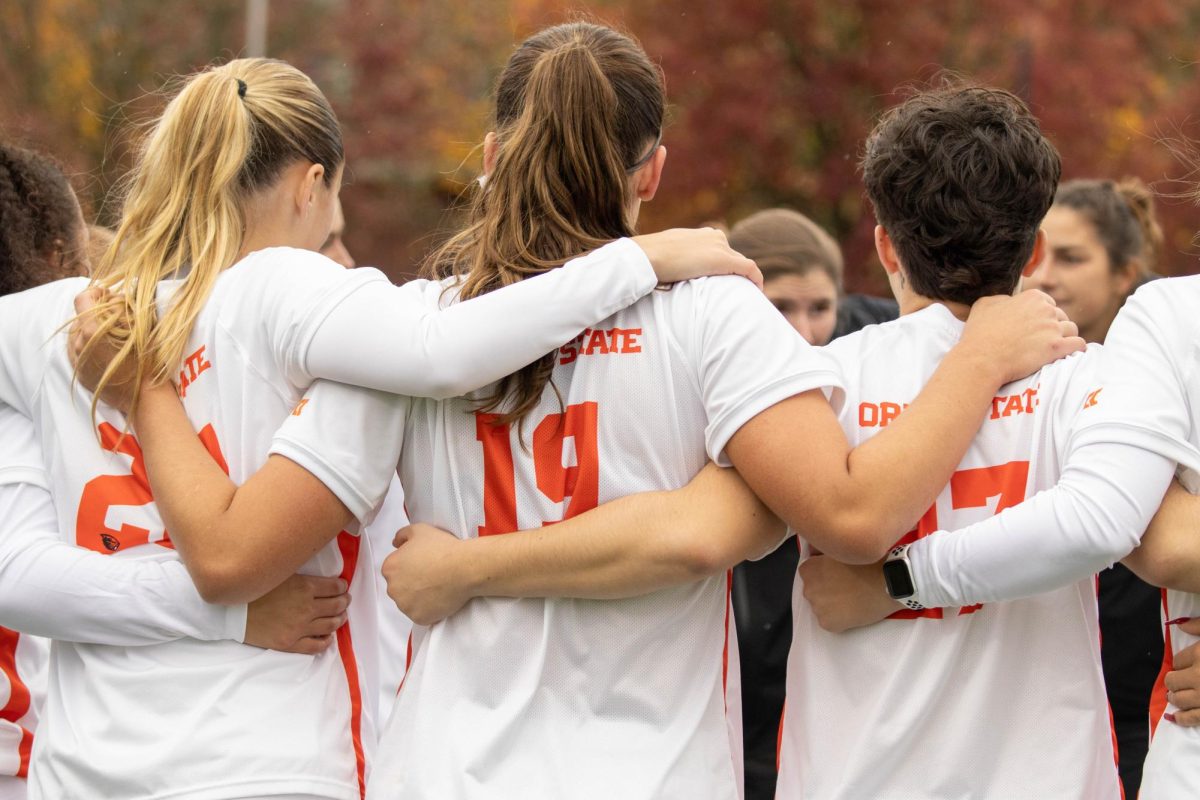 OSU Womens Soccer team celebrates the victory with a group hug on Paul Lorenz Field Nov 2 2024.