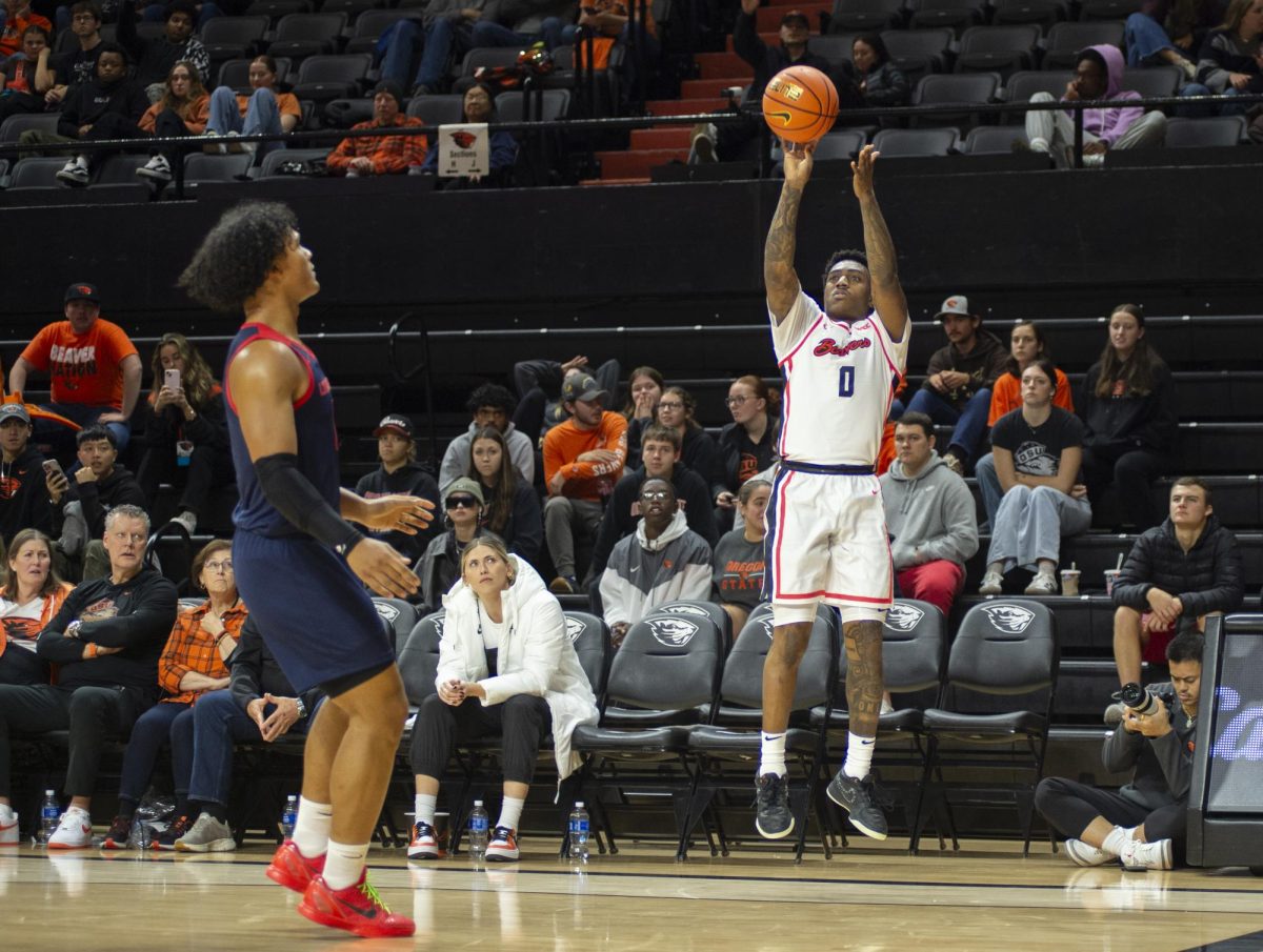 Beaver guard Damarco Minor (0) lets it fly from the corner against Utah Tech in Gill Coliseum on Nov 4, 2024