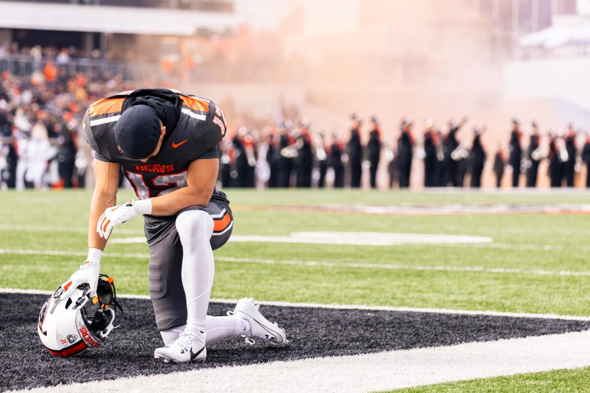 Wide Receiver Zachary Card (12) takes a knee before kickoff against San Jose State
University at Reser Stadium on Nov 9, 2024.