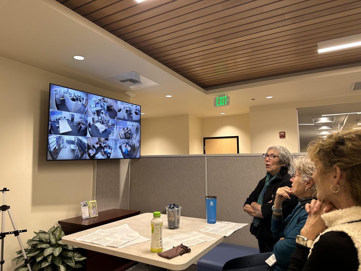 Election observers Suzanne Ortiz, left, Corey Arentz and Charlene Hall watch on a monitor as ballots are processed at the Benton County Elections Office. Observers are able to see all steps of the ballot-counting process on the monitor.