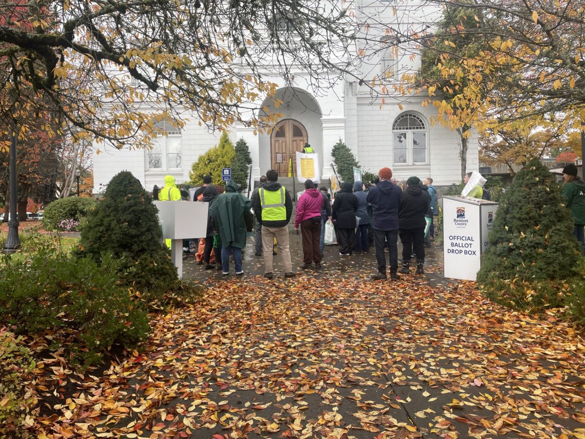 Strikers stand outside of Benton County Courthouse Wednesday morning. 