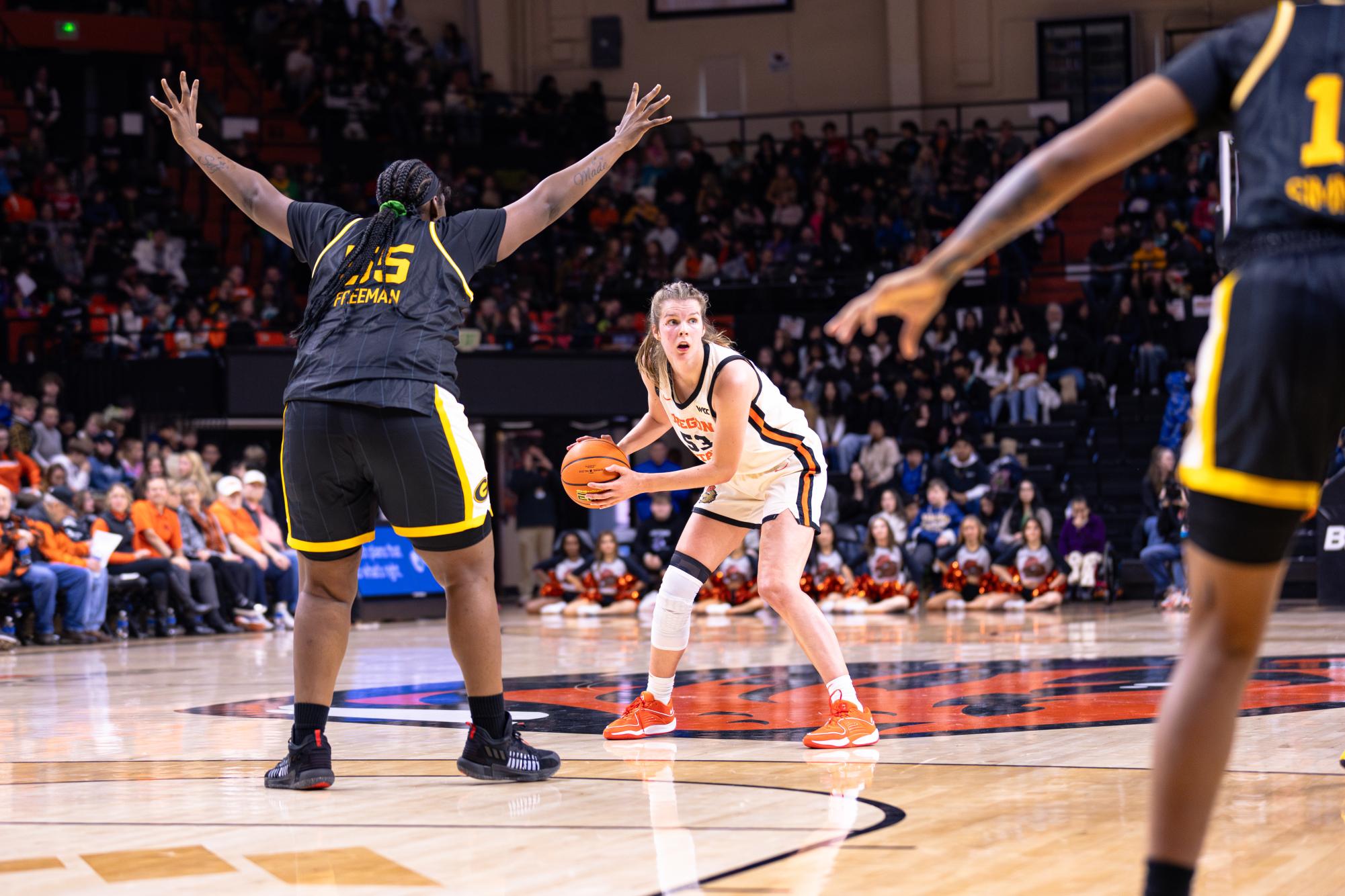 Kelsey Rees (53) scans the court to pass the ball at Gill Coliseum in Corvallis on Dec 3, 2024