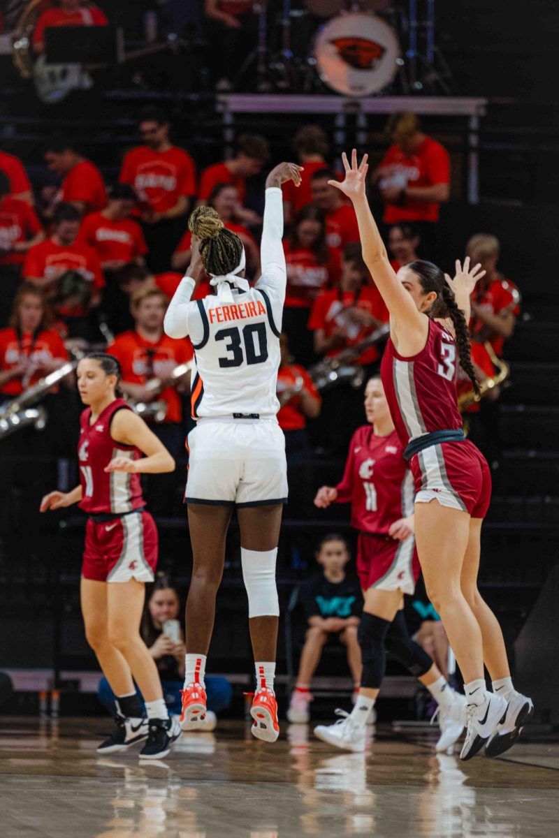 Senior, Caterina Ferreira (#30) shoots to score in a game against Washington State on Jan 27, 2025 in Gill Coliseum.