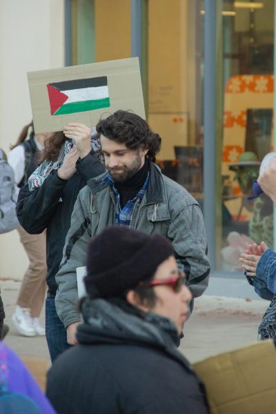 Dylan Perfect, a former ASOSU vice president helps lead the student gathering outside the Student Experience Center at Oregon State University on Dec 4th. The gathered students urged ASOSU President Audrey Schlotter to pass the bill “Working Group on Social Responsibility in Allocations” which directly addressed the Israel-Palestine conflict and revealed how much funding had gone to Israel.