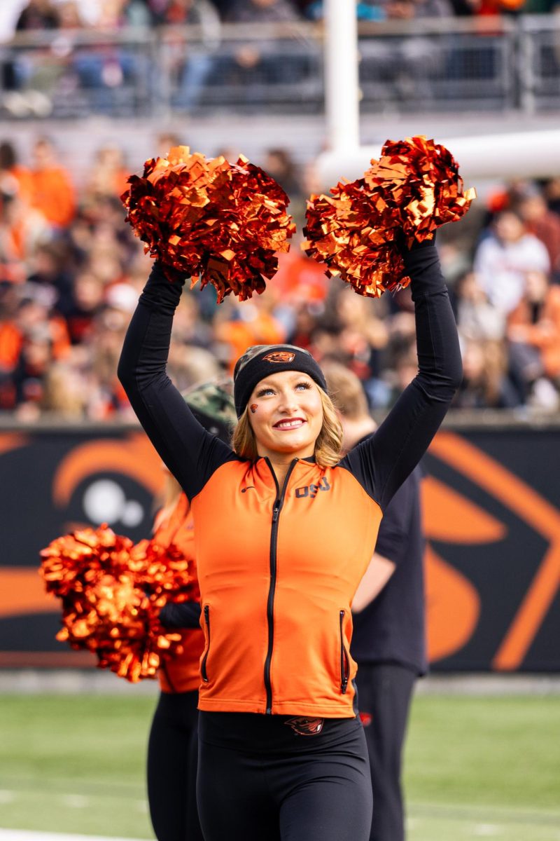 Oregon State University Cheer Team member cheers before kickoff against San Jose State University at Reser Stadium in Corvallis on Nov 9, 2024