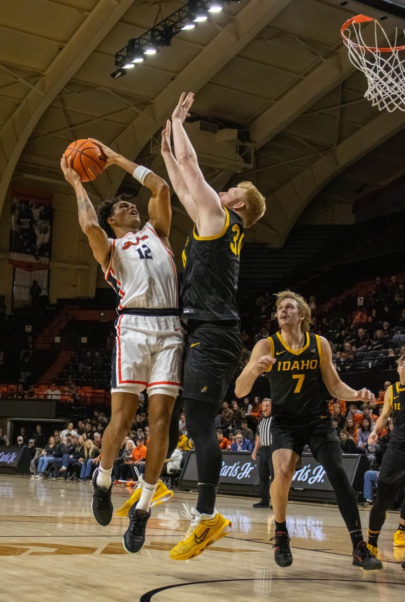 Forward Michael Rataj (12) jumps to shoot a basket at the home game against the Idaho Vandals Dec. 7.