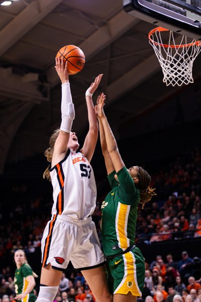 Forward Kelsey Rees (53) reaches for the basket past San Francisco Don’s defense in Gill Coliseum on Jan. 9, 2025.