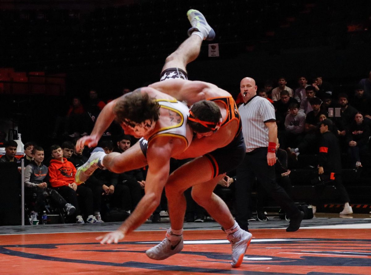 Redshirt Sophomore Murphy Menke attempts to slam his Wyoming opponent in Gill Coliseum on Jan 19, 2025