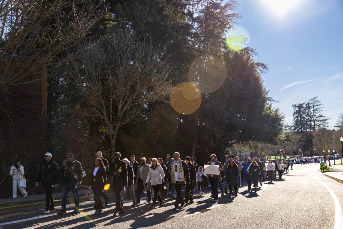 The annual Dr. Martin Luther King Jr. Day Peace March walks up SW 26th St on Jan. 20, 2025. Over 100 people including students, faculty, alumni, and community members participated in last year’s Peace March.