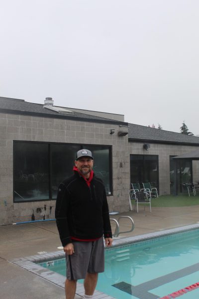 Rick Guenther, the head of the Corvallis Aquatics Team, stands at the Timberhill Athletic Club pool. The teams usual pool is closed until further notice due to corrosion.