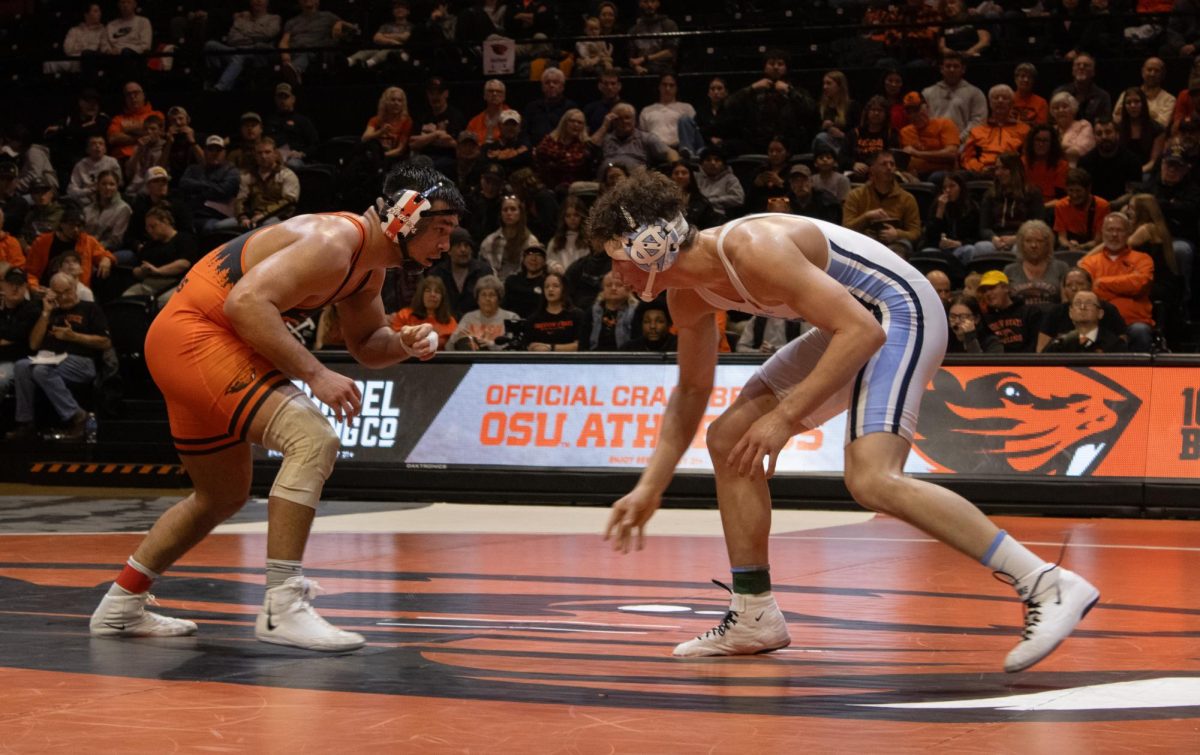 Senior Trey Munoz, gets into position at the afternoon wrestling match in Gill Coliseum Feb. 23. The Beavs took home the win against North Carolina with a score of 22-1