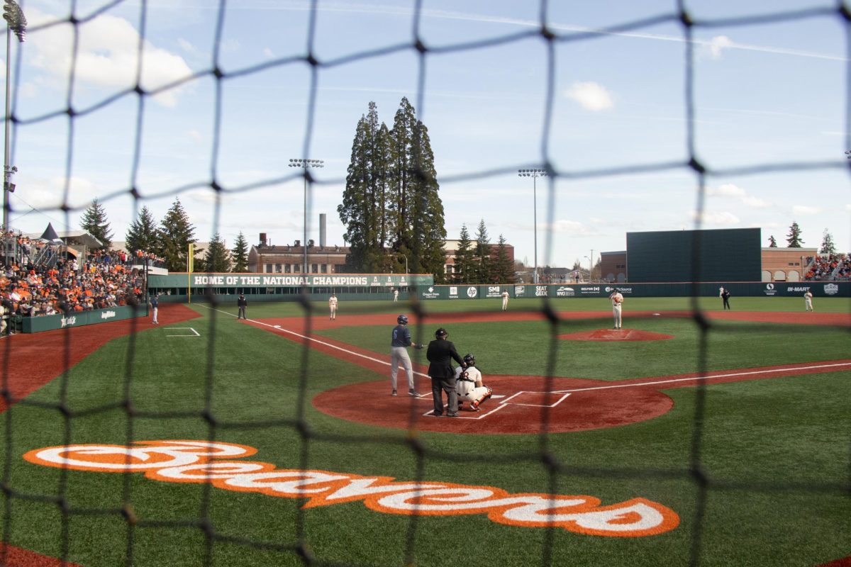 OSU baseball team members set up for a play in Goss Stadium at Coleman Field Sat. March 8. The Beavs took home the win against San Diego 2-0.