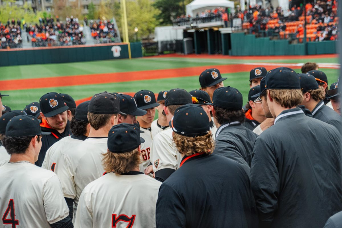 The Beaver baseball gathers in a huddle in a game against the Ducks in Goss Stadium on April 27, 2024