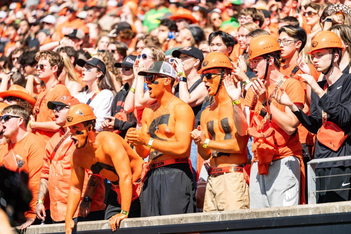 Oregon State fans pose for a picture at this year’s home football game against the Oregon Ducks at Reser Stadium on September 14, 2024. Fans are excited to see former Beavers in pro leagues.
