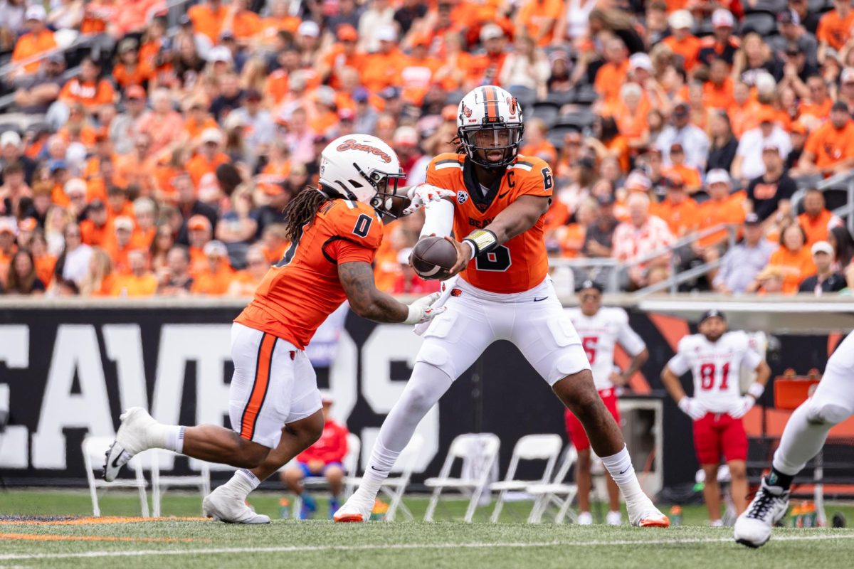 Quarterback Maalik Murphy (6) hands the ball off to running back Anthony Hankerson at the game against Fresno State University on Sept. 6, at Reser Stadium. In the second home game of the 2025 season, the Beavers lost to the Bulldogs 36-27.