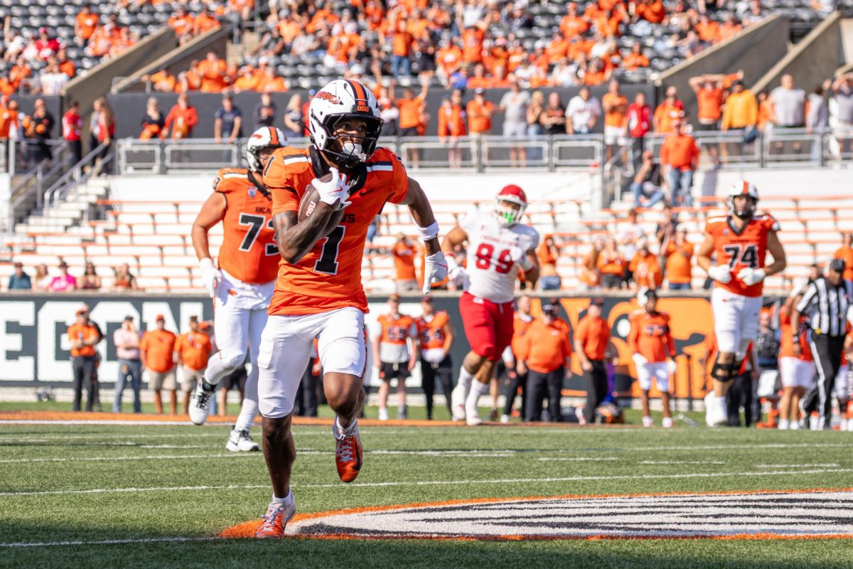Wide receiver David Wells Jr. (1) catches the ball and completes a touchdown at the game against Fresno State University on Sept. 6, at Reser Stadium.