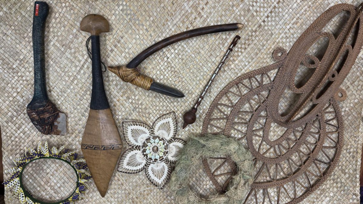 Various cultural items from different Pacific Islands including a woven headband from the Marshall Islands, a woven flower with a shell design from Pohnpel and an adz, a shell adze, a wooden carved spear and a woven yam mask from Papua New Guinea are displayed in Patricia Fifita's office at Oregon State University on Aug. 21. These cultural items and more will be on display in a gallery in Fairbanks Hall throughout fall term.
