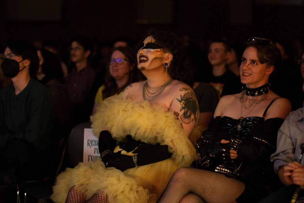 Drag queen Crusty Kuntz smiles in the crowd during Richard Rider's presentation on
Halloween's history, at the Rainbow Continuum Fall Drag Show "A Night at the Ball" in
the Memorial Union Ballroom on Oct. 25.