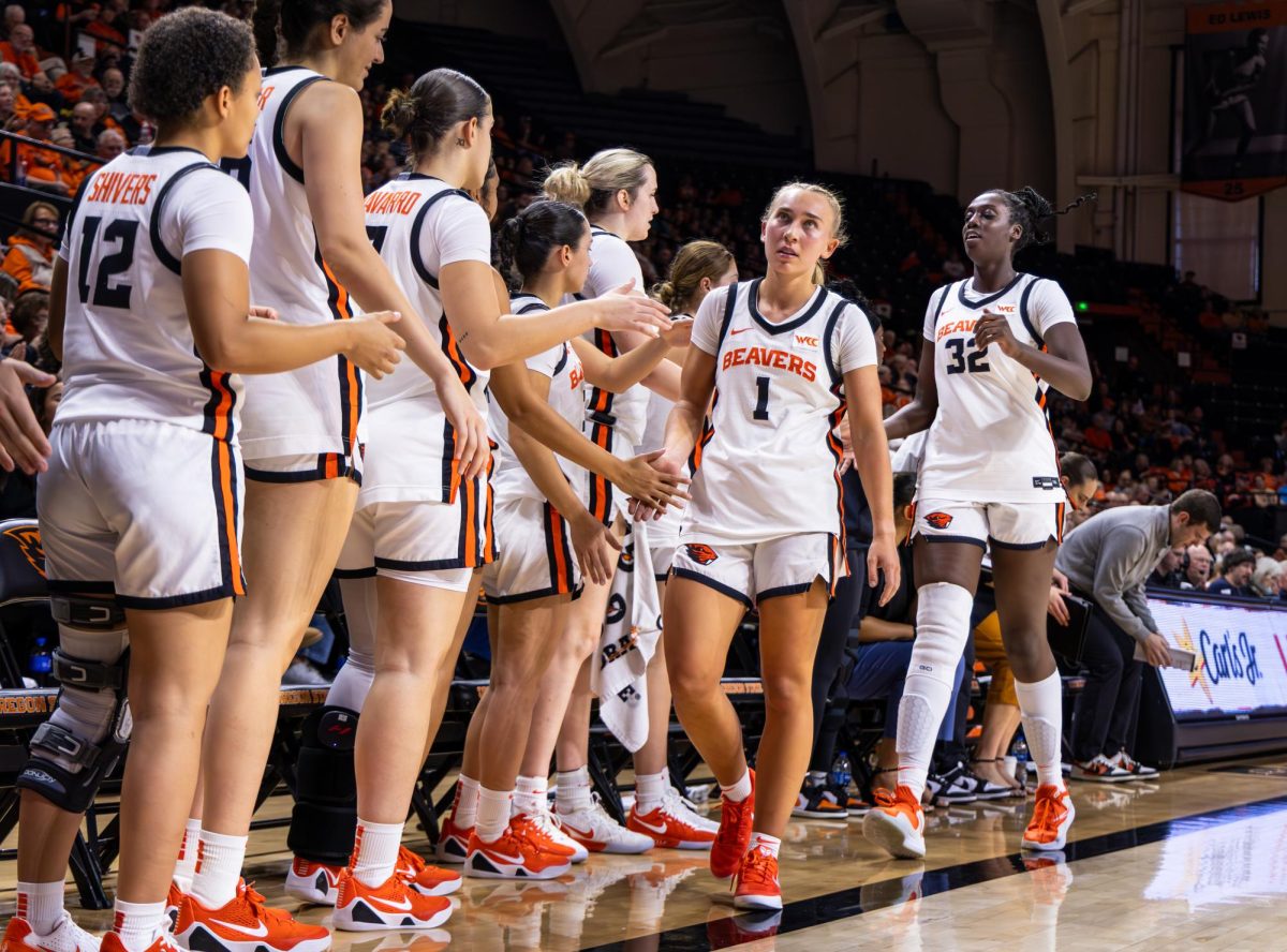 Oregon State University guard Kennedie Shuler (#1) and forward Néné Sow (#32)
high-five their teammates after coming off the court during OSU’s game against Seattle University in Gill Coliseum in Corvallis, Ore., Jan. 10, 2026. The team looks to finish off their final leg of the season and make it to March Madness