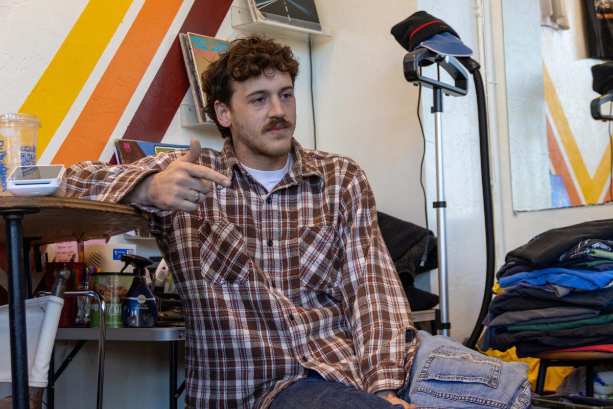 Jarius Lovell reflects on his path from his college side hustle to a small business owner at TSA Vintage in Corvallis on Oct. 13, 2025. According to Lovell, the majority of his customers are college students.