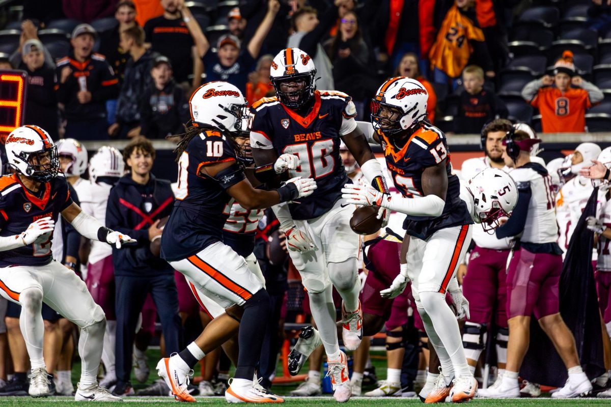 Jojo Johnson (#90) celebrates his interception with Shamar Meikle (#13) and Zakaih Saez (#10) in the Beavers 45-13 victory over the Lafayette Leopards on Oct. 18, 2025 in Reser Stadium. Johnson is set to join Texas Tech for the 2026-27 season
