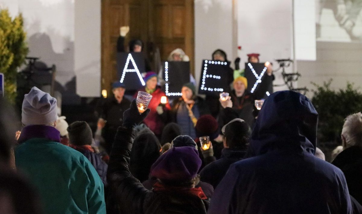 Corvallis residents listen to singers and speakers on the courthouse steps during the candlelit vigil honoring Alex Pretti outside the Benton County Courthouse on Jan. 27. This vigil was put on by the Benton County chapter of the activist organization Indivisible. It was held for victims of ICE, particularly Alex Pretti who was an intensive care nurse for the US Department of Veterans Affairs who was shot and killed in Minneapolis, Minnesota on Jan. 24, 2026.