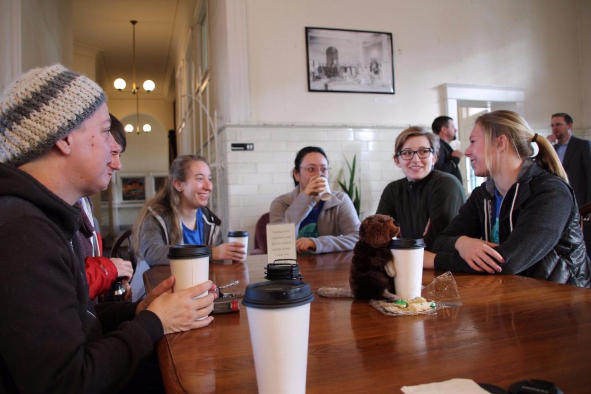 The Yakima alternative break students gather around a table to discuss their work in. The Alternative Spring Break will be offered during the 2026 spring break.