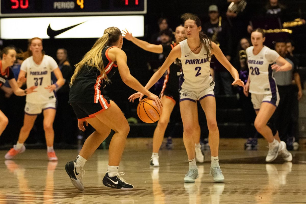 University of Portland guard Dyani Ananiev (2) defends Oregon State’s guard Kennedie Shuler (1) on the Chiles Center Court on Saturday, Feb. 7 during the game against the University of Portland. OSU’s defense held a close game despite losing 53-50.