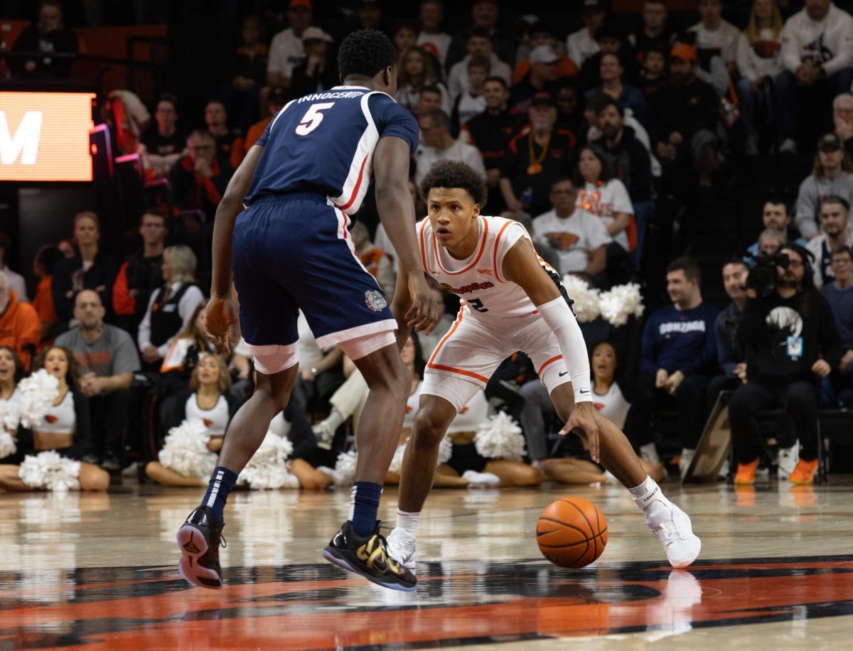  Josiah Lake II (2) takes the ball up court while being guarded during Oregon State’s game against Gonzaga at Gill Coliseum on Feb. 7. Oregon State loses 81–61.