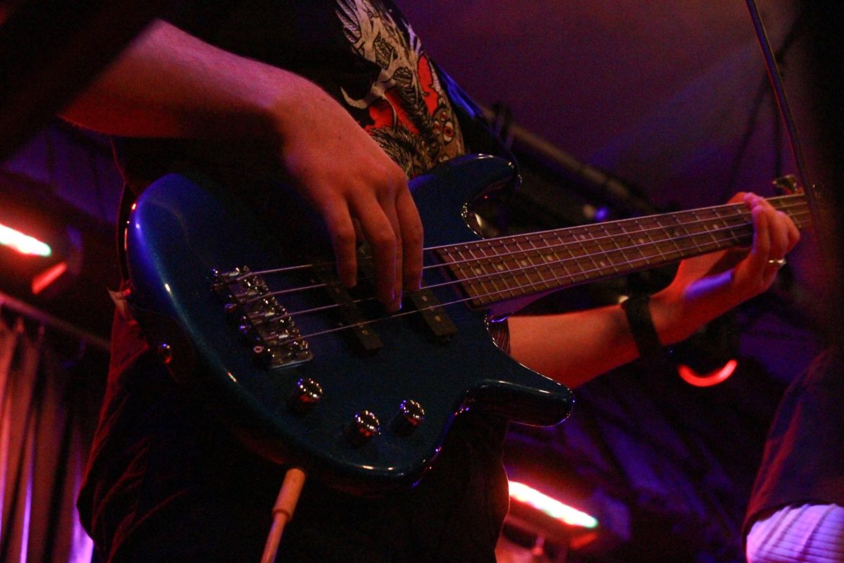 The bassist for the student band, “Theoretical Beard,” plays alongside his peers as they cover “American Idiot” by Green Day.