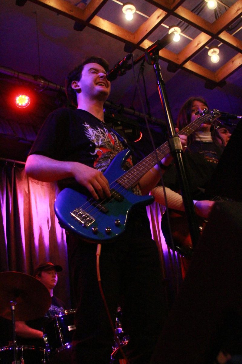The bassist for the student band, “Theoretical Beard,” plays alongside his peers as they cover “American Idiot” by Green Day.