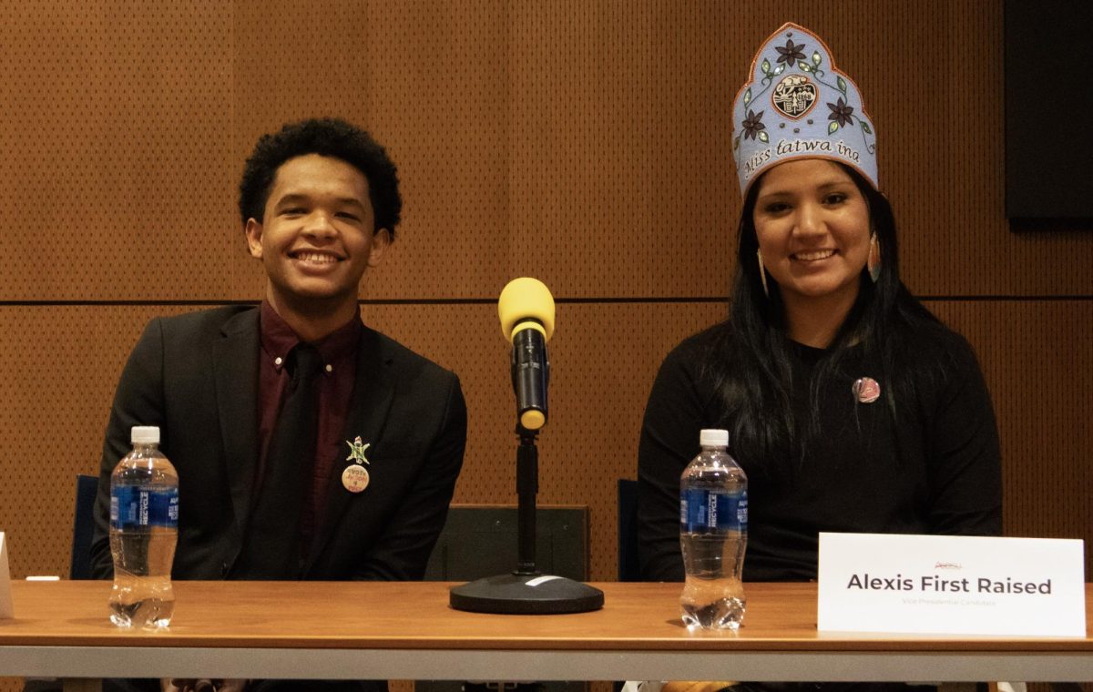 ASOSU Presidential candidate Jason Williams (left) and Vice Presidential candidate Alexis First Raised pose for a photograph after the ASOSU debates in the Memorial Union