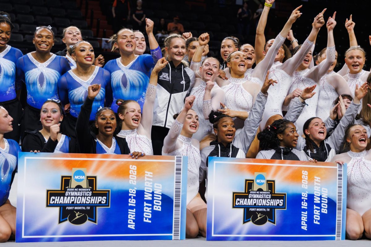 The UCLA and University of Minnesota gymnastics teams hold their tickets to the NCAA Women’s Gymnastics Championship.