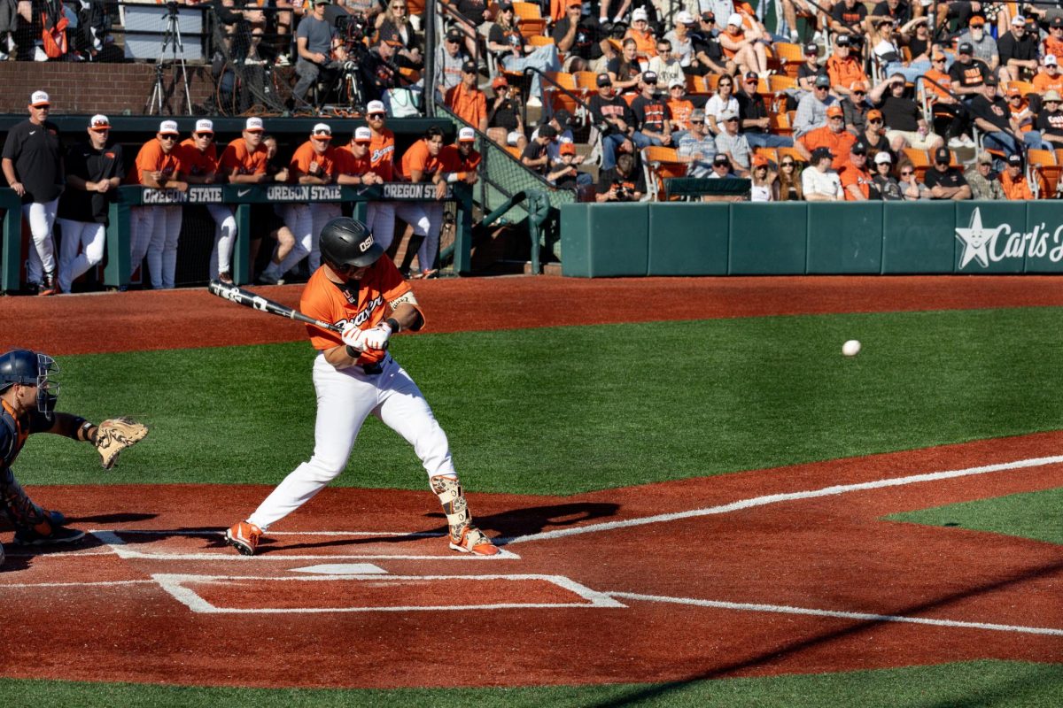 Bryson Glassco (20) swings at a pitch during Oregon State’s game against Cal St. Fullerton in Goss Stadium on April 18, 2026. Oregon State won game two of the three-game series, 6–1.