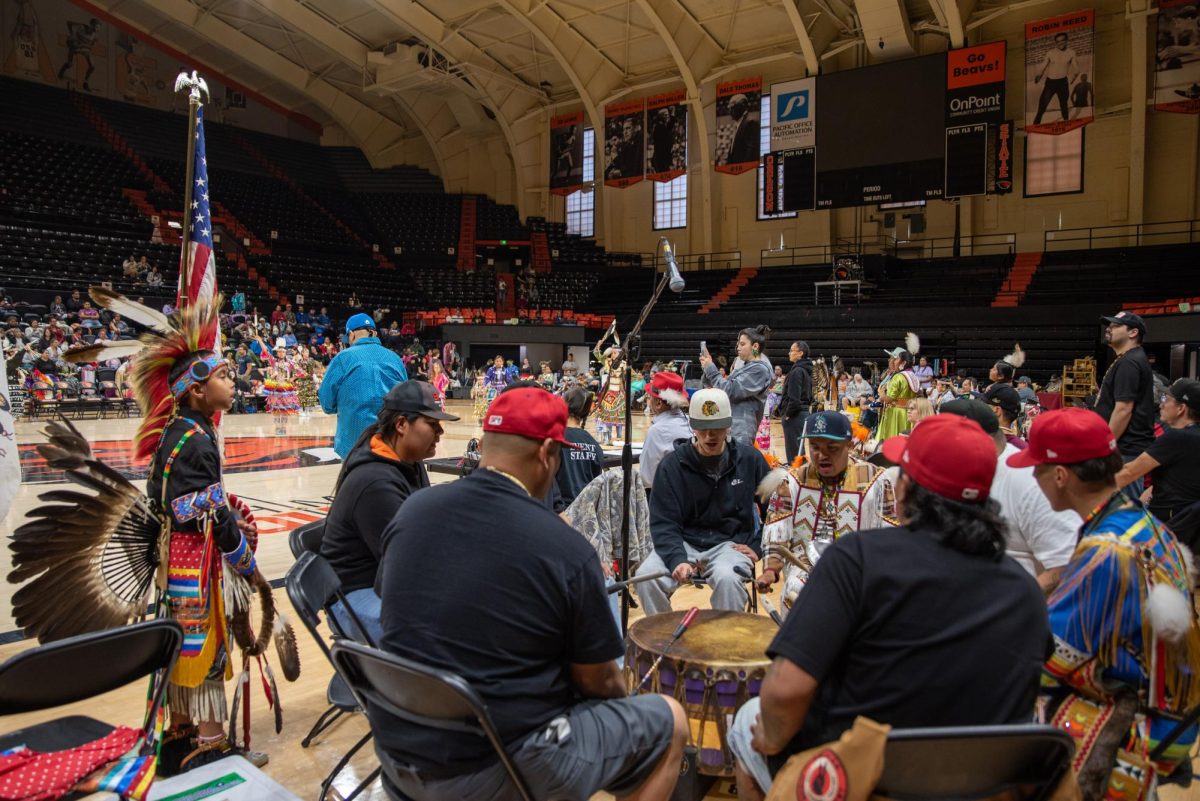 A group of men drumming.