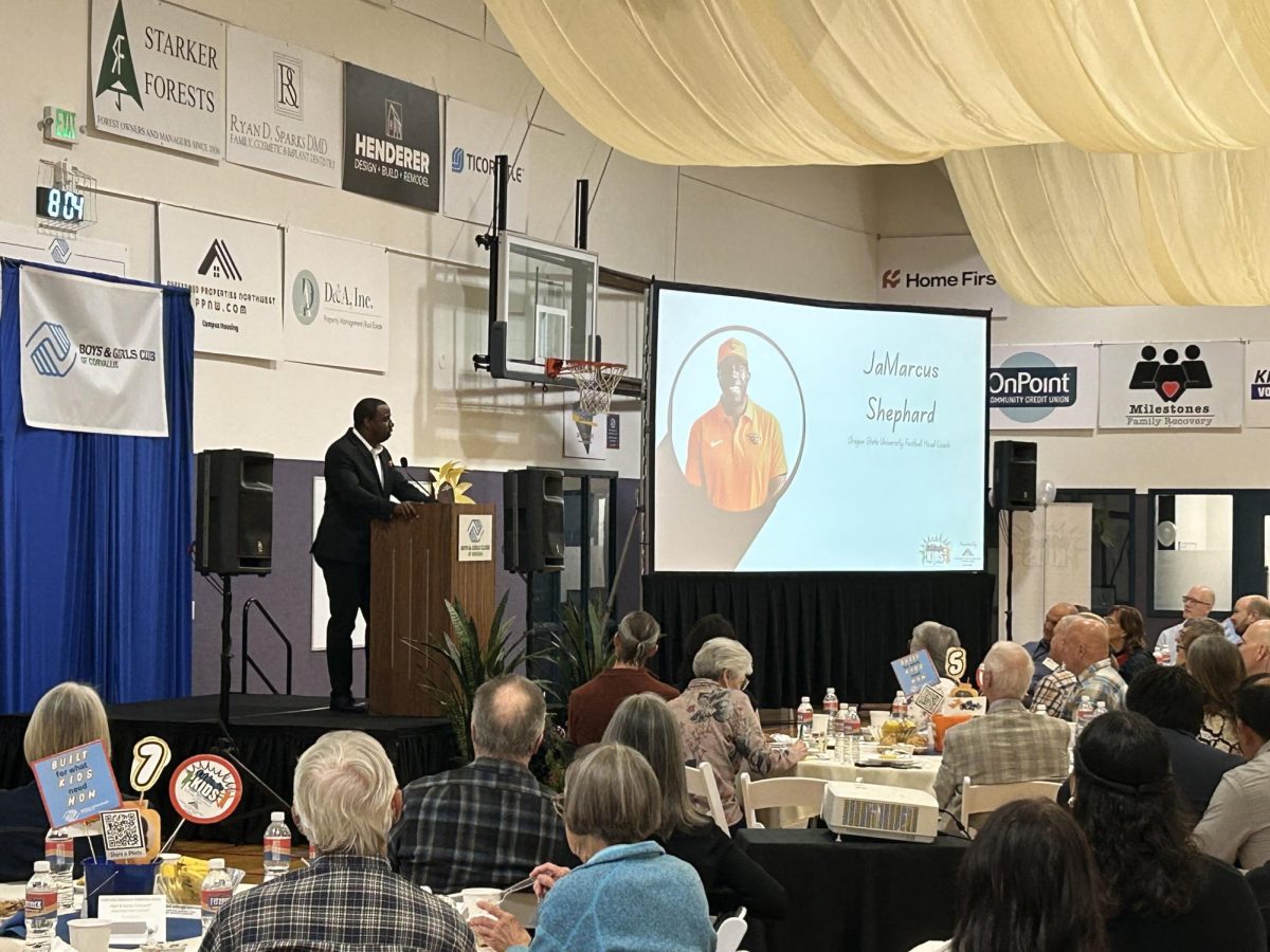 Head Coach JaMarcus Shephard gives a speech at the Boys & Girls Club of Corvallis’ 28th annual Celebrate Kids Breakfast on Thursday morning.
