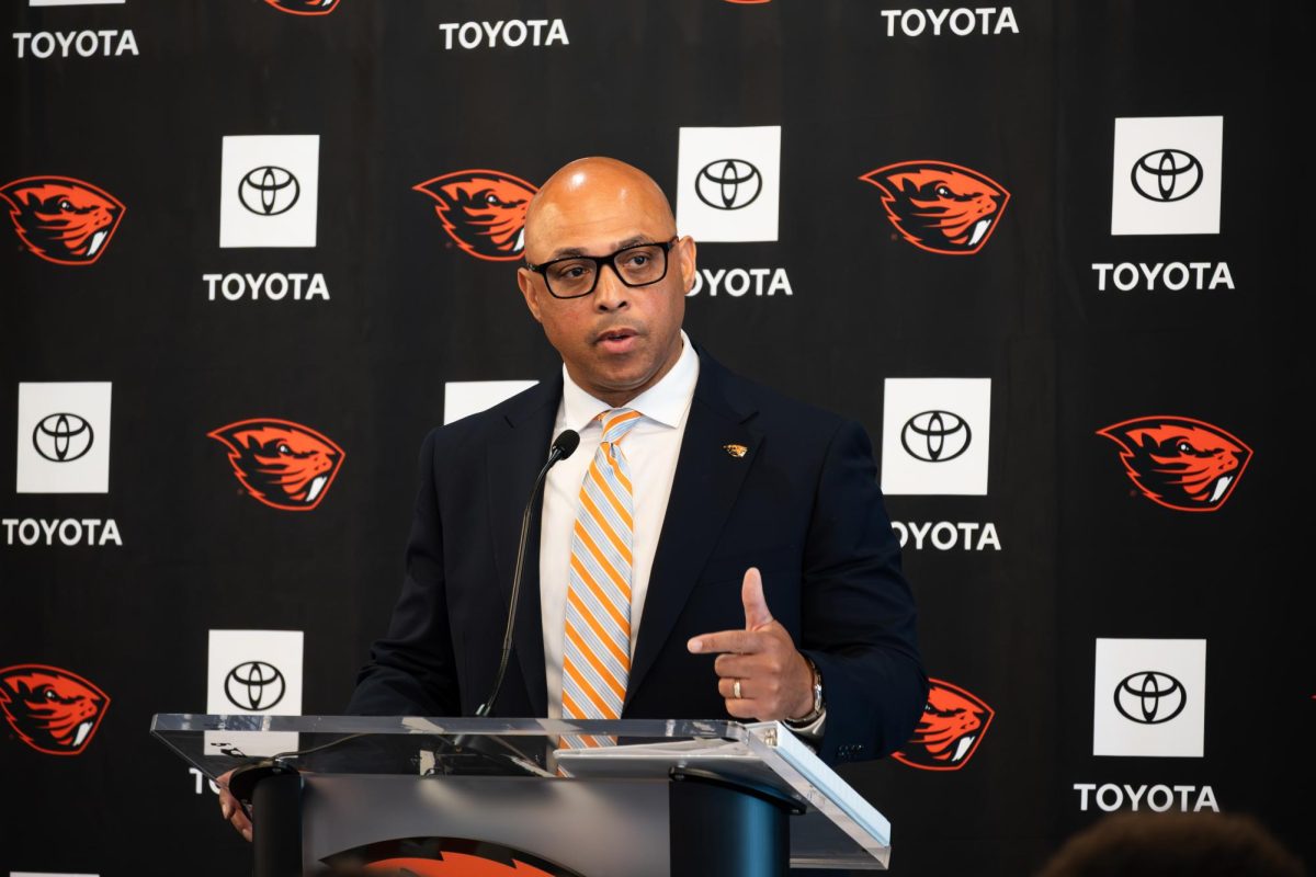 A man speaks at a podium.