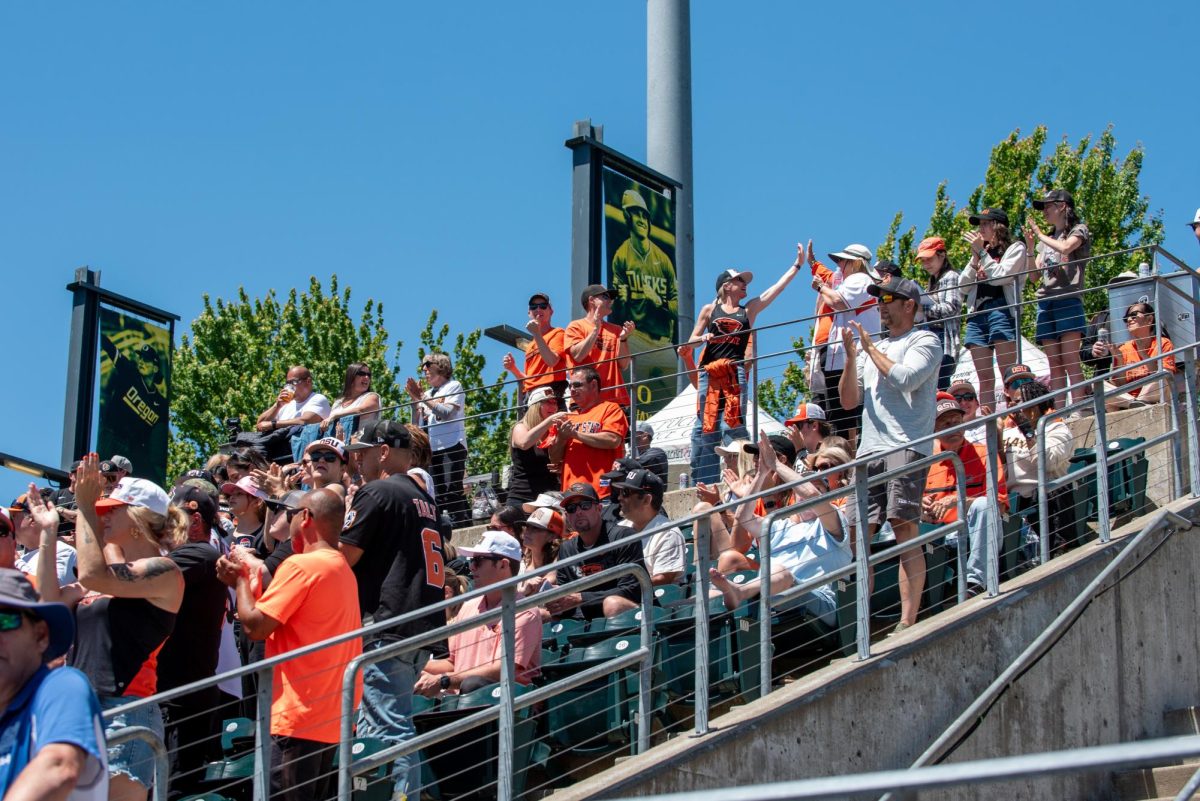 Oregon State baseball fans cheer in the stands.