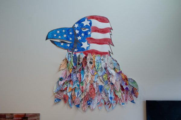 Eagle collage with feathers and a red, white and blue head. 