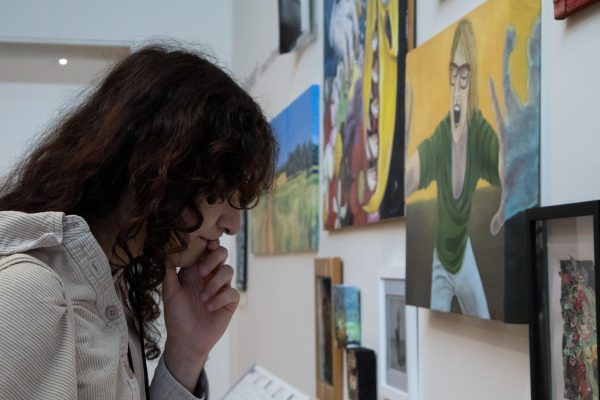 Person looks at photos.