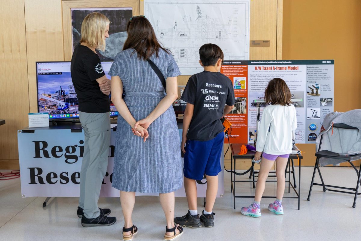 Attendees of the 2025 Kaleidoscope Festival view a STEM presentation in the PRAx lobby on May 10, 2025. The festival features hands-on science and art activities, demos, and presentations hosted by OSU departments and the Corvallis community.