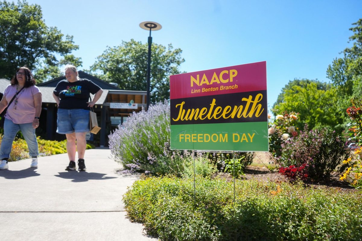 A sign for Juneteenth stands outside of the Corvallis Community Center on June 20, 2026. The event included free food, games and activities, music and dancing, and a keynote address from Dr. Dana Emerson.