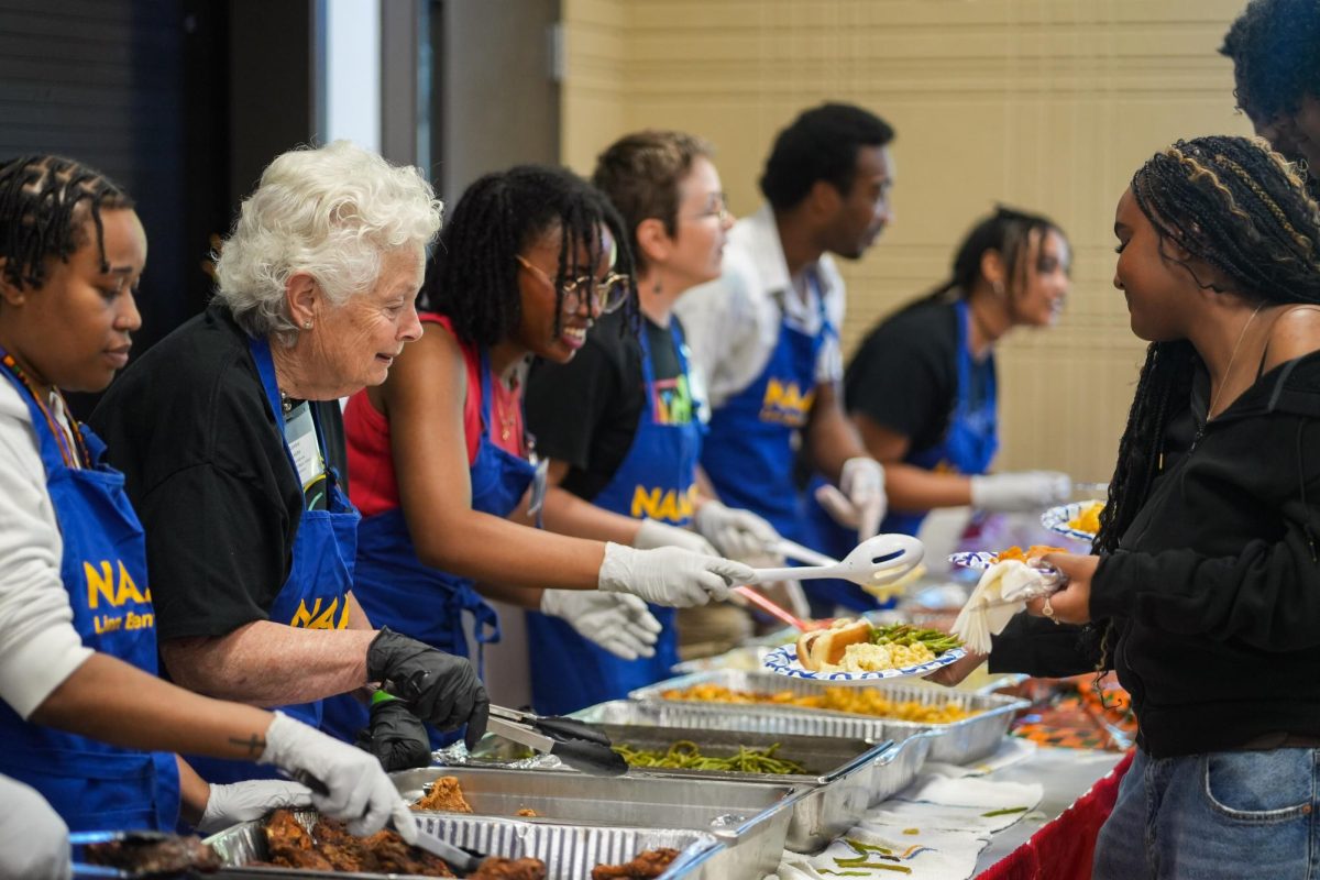 Volunteers of the Linn Benton NAACP branch serve meals to attendees on June 20, 2026 in the Corvallis Community Center. Guests enjoyed an array of free soul food, an ethnic cuisine originating from African Americans in the South.
