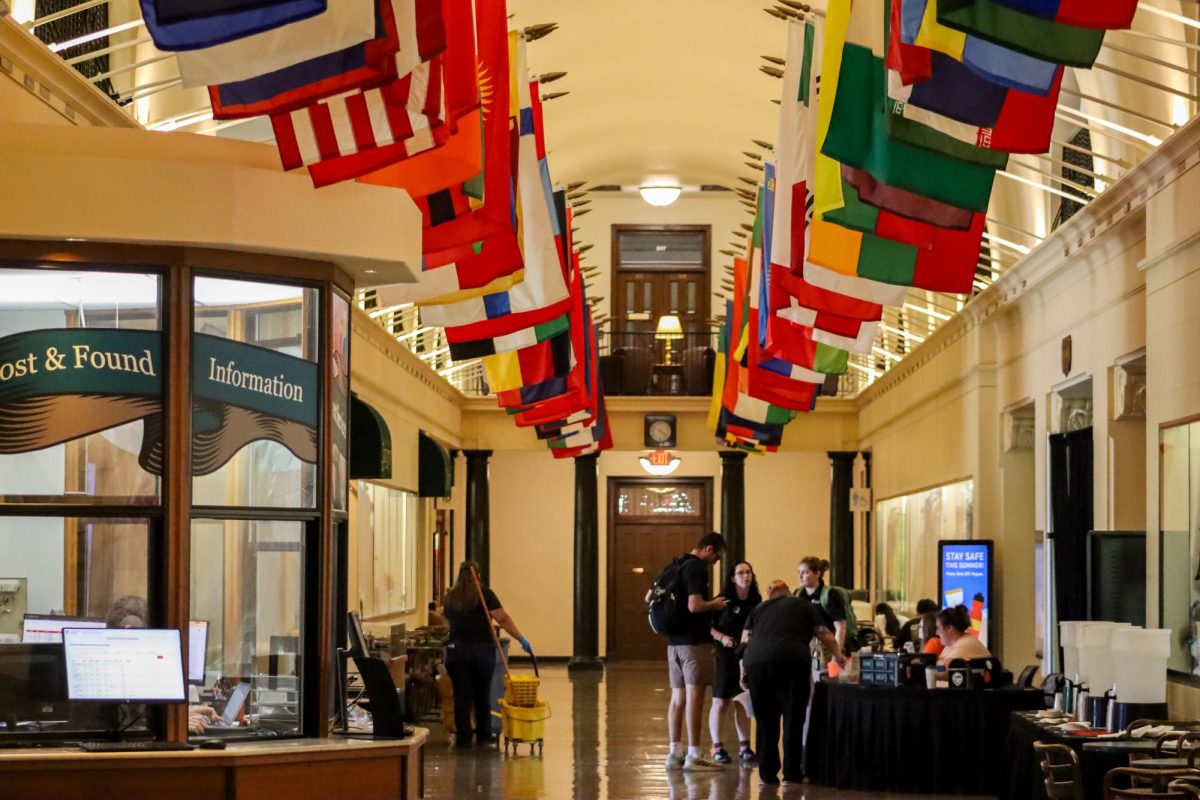Students walk through the Memorial Union beneath international flags on June 23, 2026. The flags represent the diverse countries and cultures that make up Oregon State University's student population.
