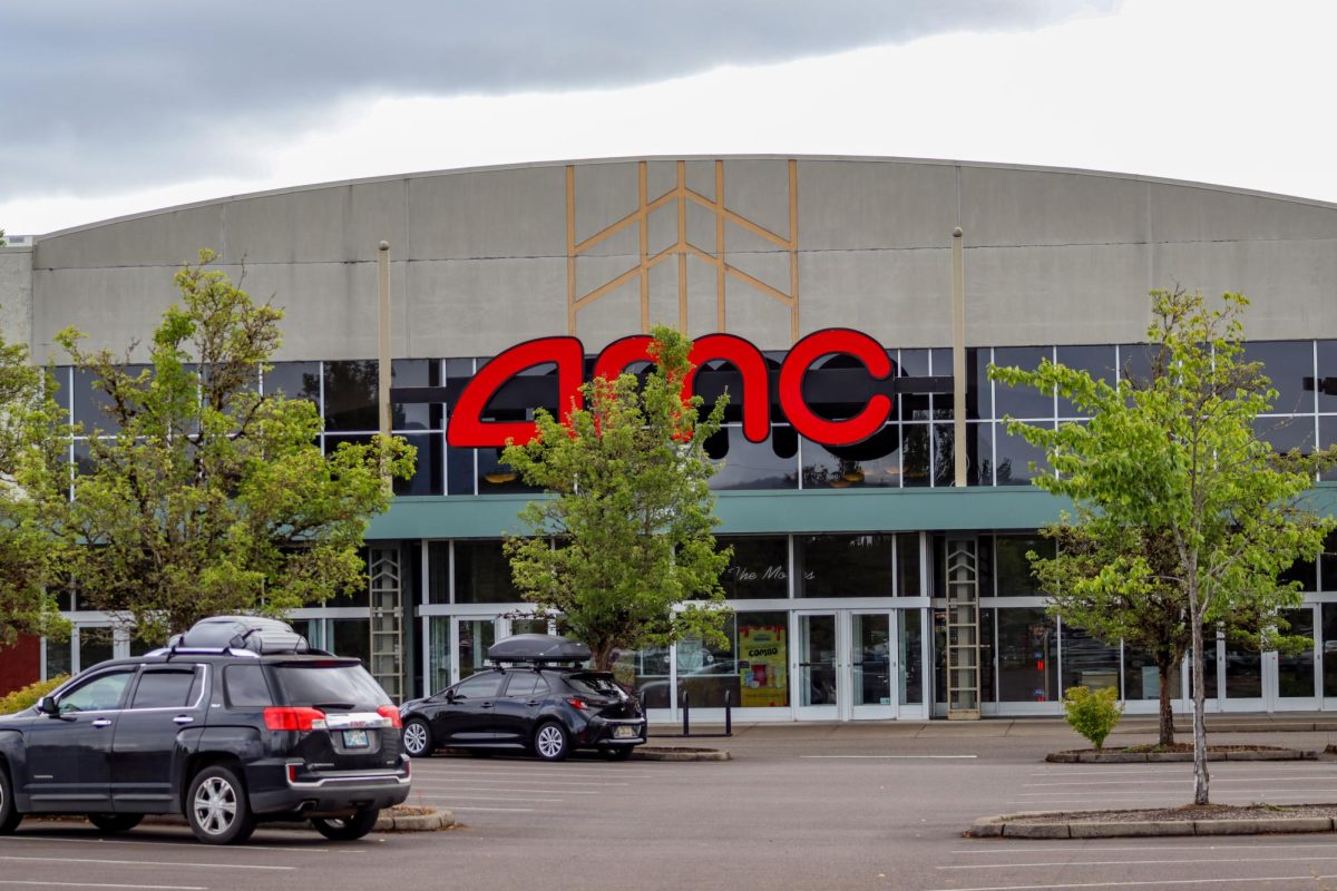 Large AMC signage is displayed above the entrance to AMC CLASSIC Corvallis 12 on June 26, 2026. The theater serves moviegoers from Corvallis and surrounding communities.