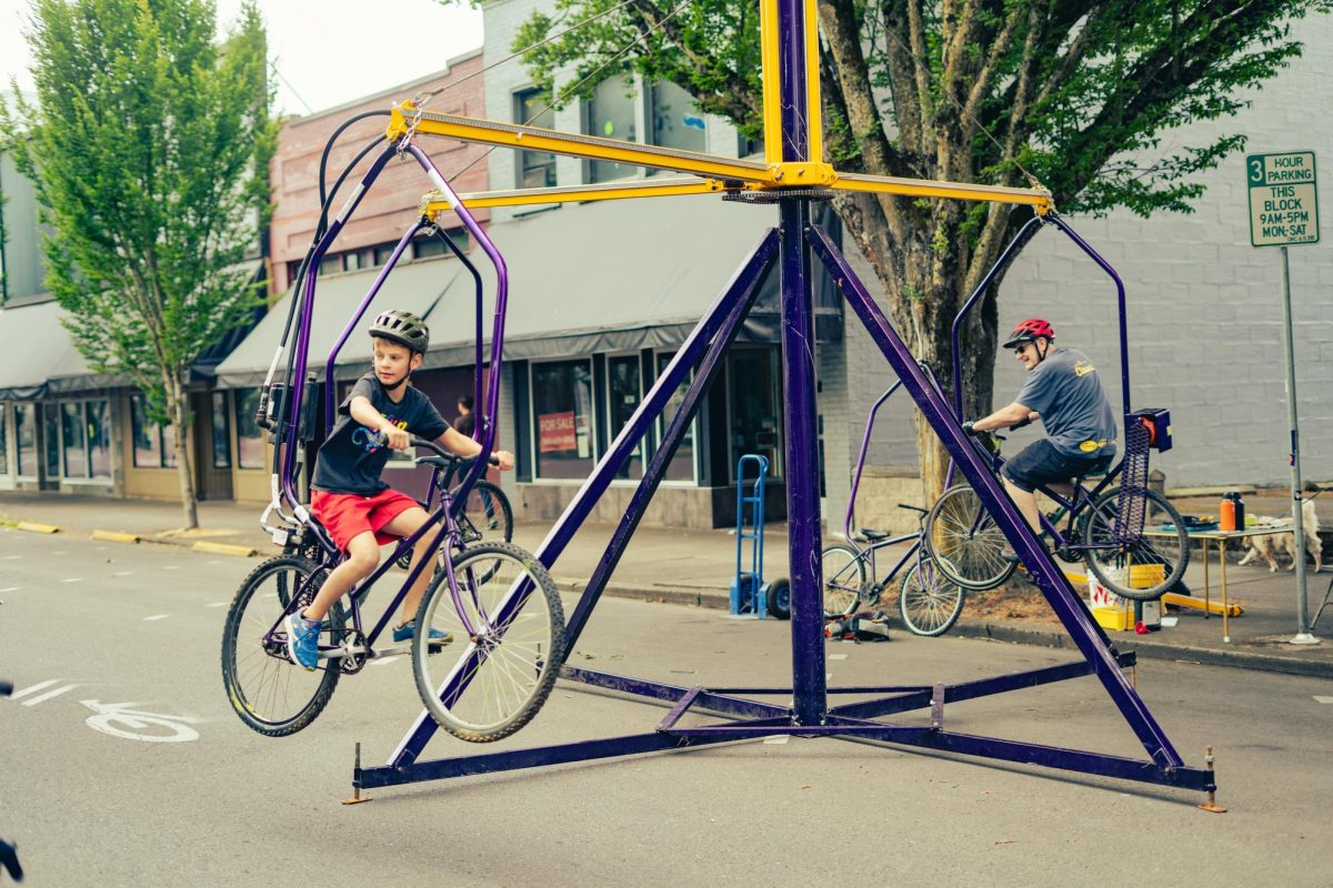 People bike on an amusement ride